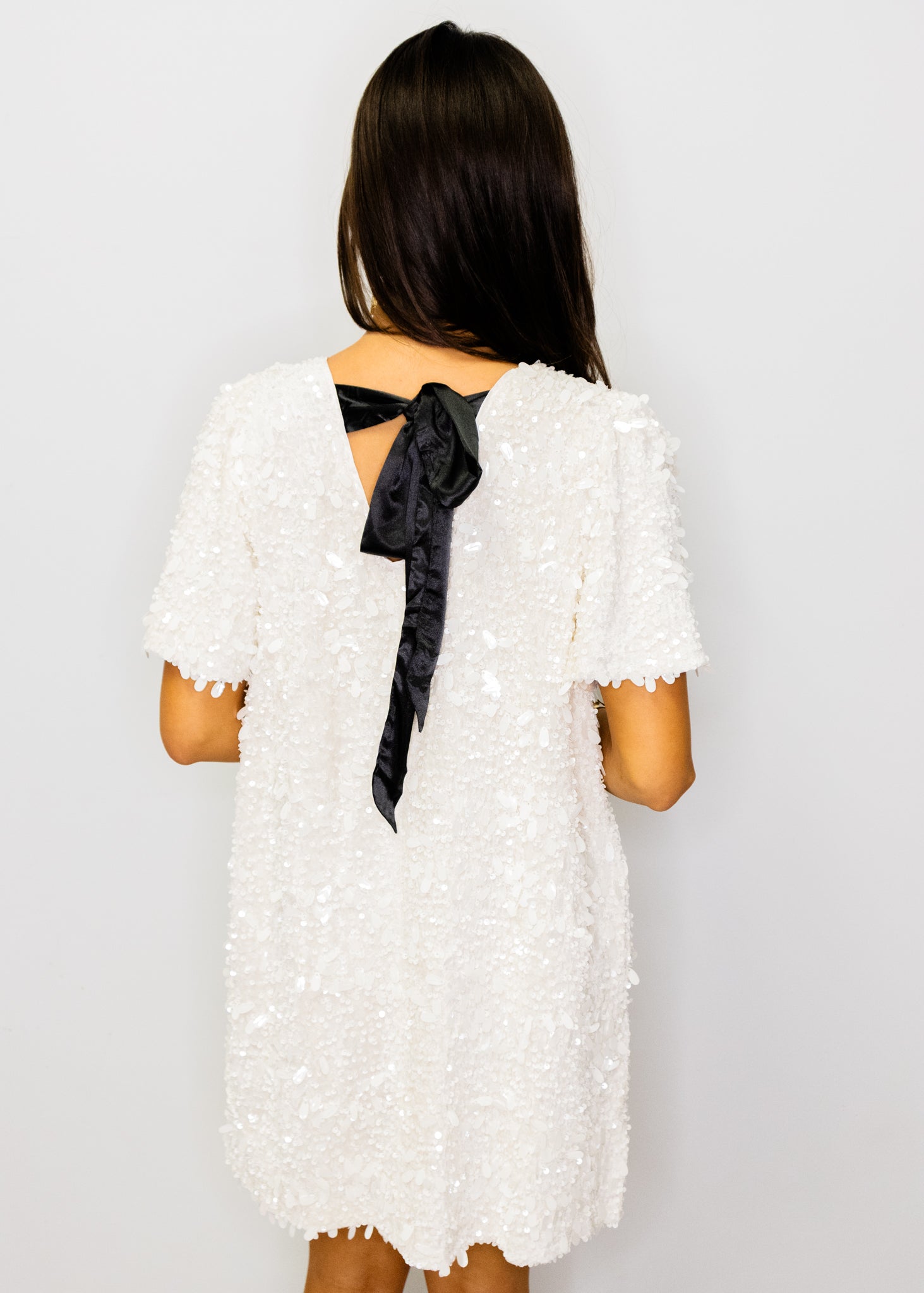 White Sequin Bow Back Shift Dress